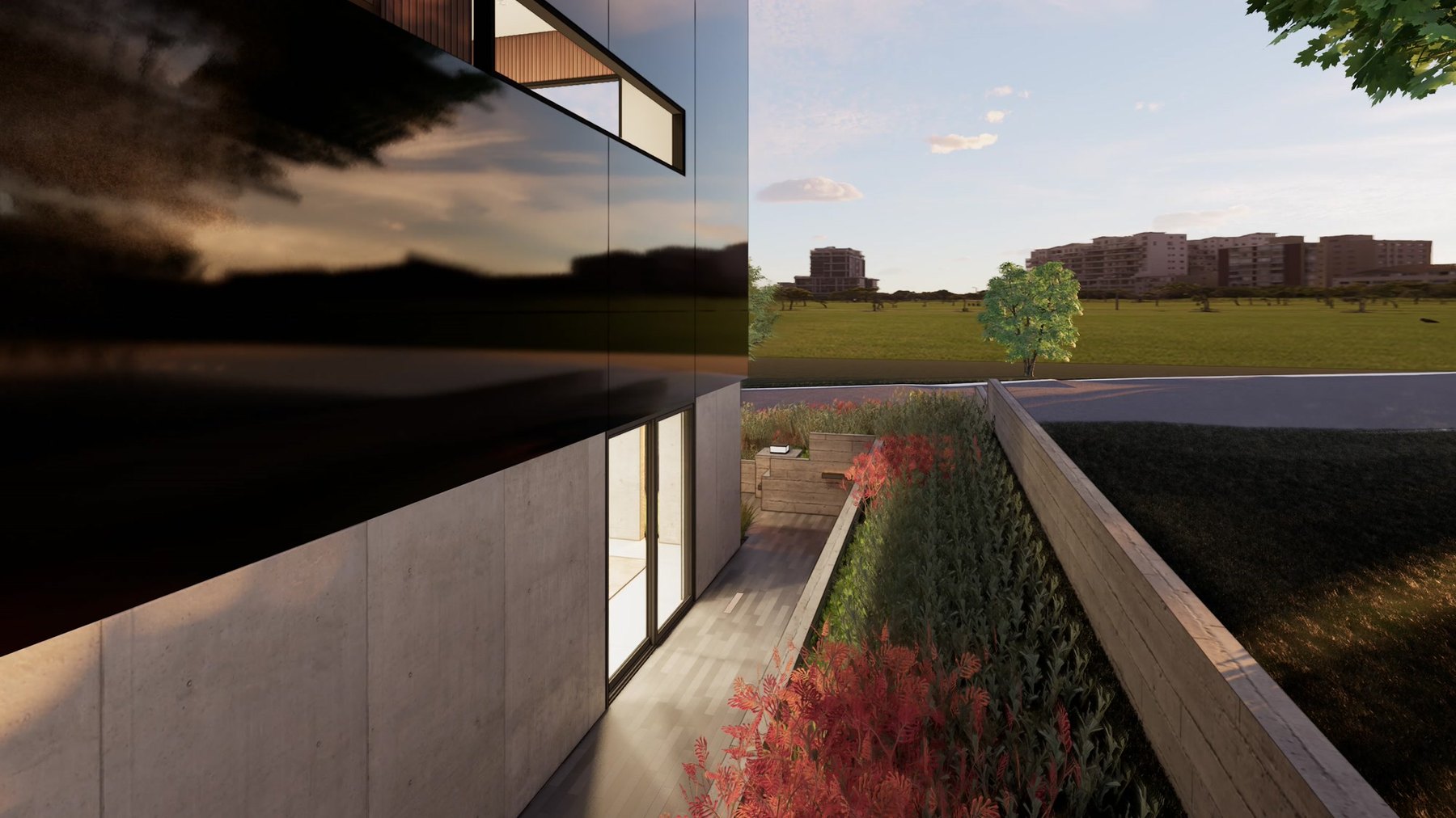 Side elevation of a contemporary residence with a dark upper volume reflecting the evening sky